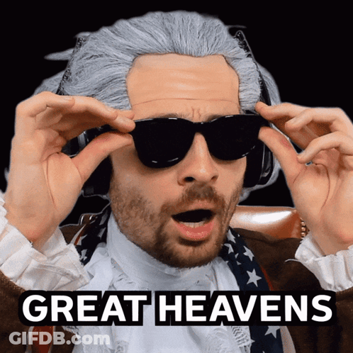 A Man Wearing A Wig And Sunglasses Has The Words Great Heavens Above His Head GIF