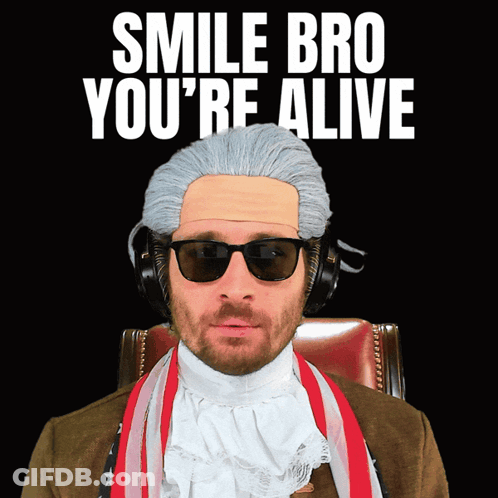 A Man Wearing A Wig And Sunglasses Has The Words Smile Bro You 'Re Alive Above Him GIF