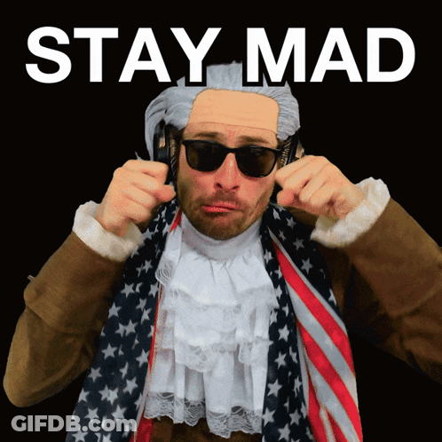 A Man Wearing A Wig And Sunglasses Has The Words Stay Mad Written Above Him GIF