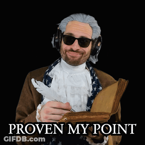 A Man Wearing A Wig And Sunglasses Is Holding A Book And A Feather In His Hand With The Words Proven My Point Below Him GIF