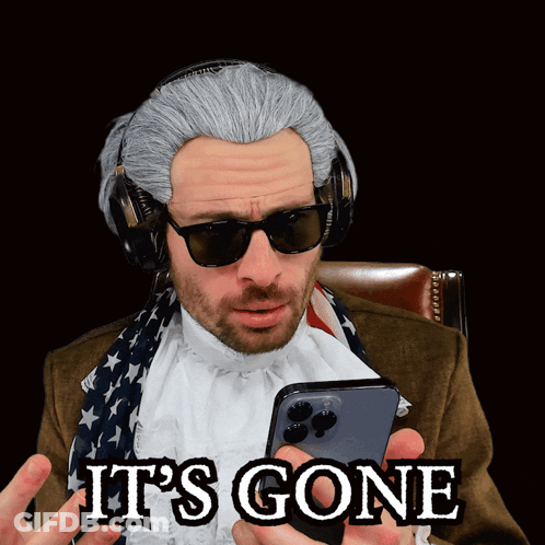 A Man Wearing A Wig And Sunglasses Is Holding A Cell Phone With The Words It 'S Gone Written On It GIF
