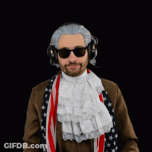 A Man Wearing A Wig And Sunglasses Is Pointing At Something GIF