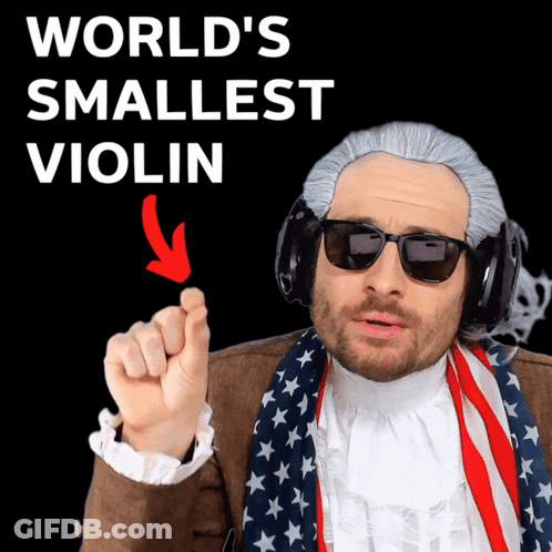 A Man Wearing A Wig And Sunglasses Is Pointing At The World 'S Smallest Violin With An Arrow Pointing To It GIF