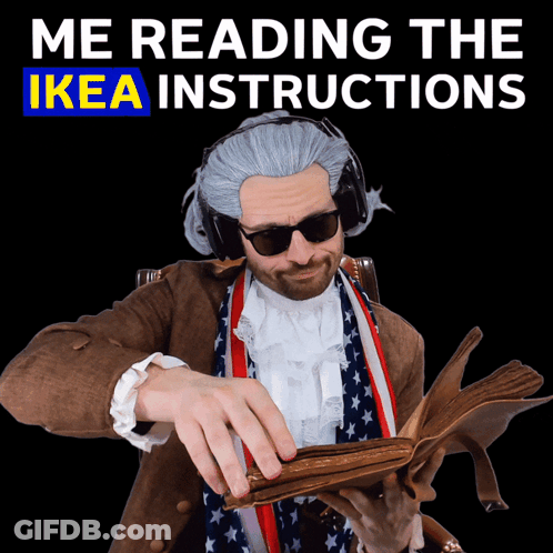 A Man Wearing A Wig And Sunglasses Is Reading The Ikea Instructions GIF