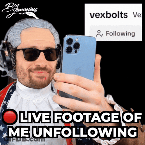 A Man Wearing A Wig And Sunglasses Is Taking A Selfie With The Words Live Footage Of Me Unfollowing Behind Him GIF