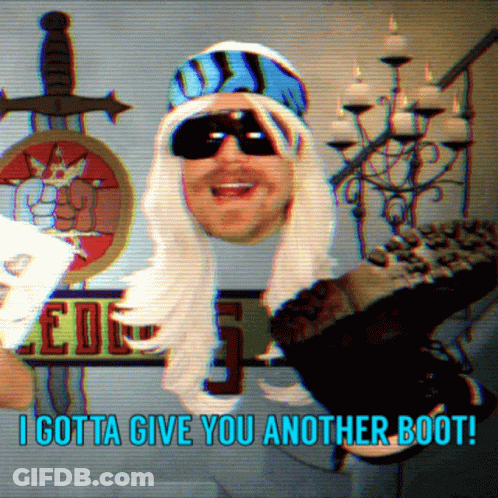 A Man Wearing A Wig And Sunglasses Says I Gotta Give You Another Boot GIF