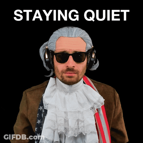 A Man Wearing A Wig And Sunglasses Stands In Front Of A Black Background That Says " Staying Quiet " GIF