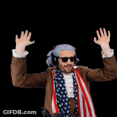A Man Wearing A Wig And Sunglasses Stands In Front Of A Sign That Says Woof GIF