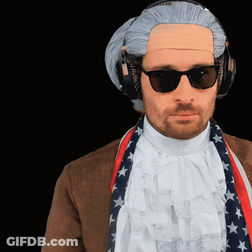 A Man Wearing A Wig And Sunglasses With Headphones On His Head GIF