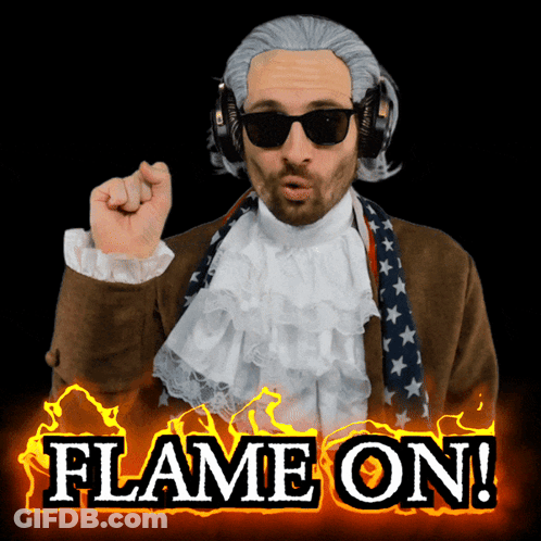 A Man Wearing A Wig And Sunglasses With The Words Flame On Behind Him GIF