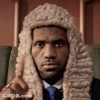 A Man Wearing A Wig And Tie Is Pointing GIF