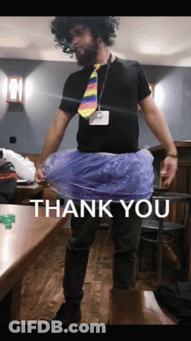 A Man Wearing A Wig And Tie Is Standing In Front Of A Thank You Message GIF