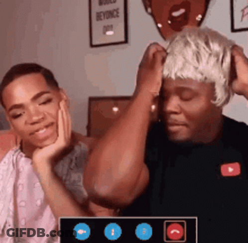 A Man Wearing A Wig Is Talking To Another Man On A Video Call GIF