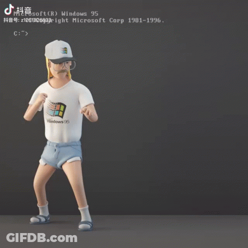 A Man Wearing A Windows 95 Shirt Stands In Front Of A Computer Screen GIF