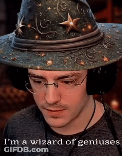A Man Wearing A Wizard Hat And Glasses Says I 'M A Wizard Of Geniuses GIF