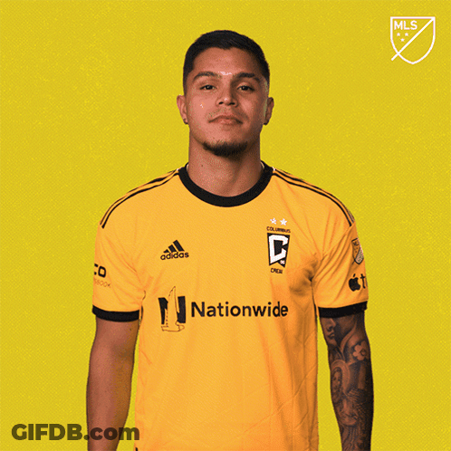 A Man Wearing A Yellow Adidas Shirt With Nationwide On It GIF