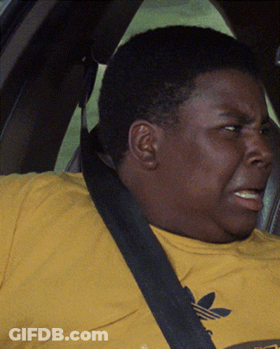 A Man Wearing A Yellow Adidas T-Shirt Is Sitting In A Car GIF