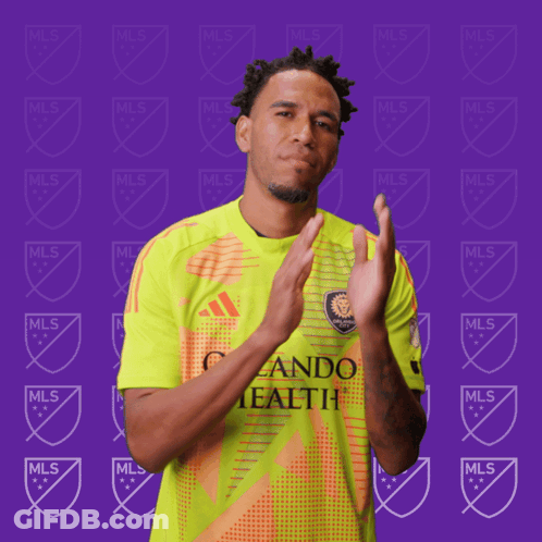 A Man Wearing A Yellow And Orange Jersey That Says Mls GIF