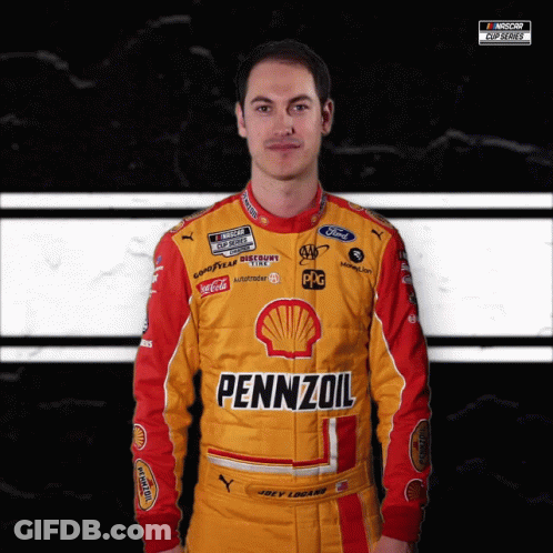 A Man Wearing A Yellow And Red Pennzoil Racing Suit GIF