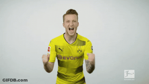 A Man Wearing A Yellow Evonik Shirt Is Screaming GIF