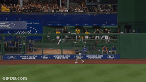 A Man Wearing A Yellow Gh Jersey Stands In The Dugout GIF