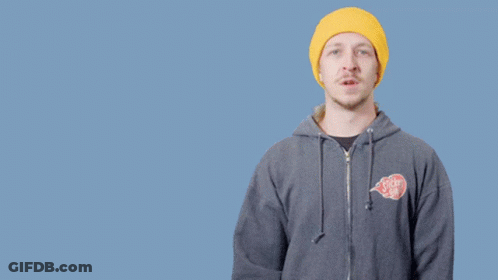 A Man Wearing A Yellow Hat And A Gray Hoodie Says " Don 'T Be A " GIF