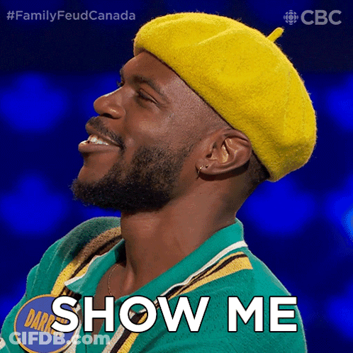 A Man Wearing A Yellow Hat And A Green Shirt Says Show Me GIF