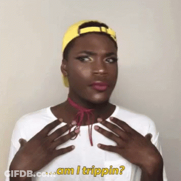 A Man Wearing A Yellow Hat And A White Shirt With The Words Am I Trippin Written On It GIF