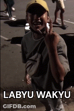 A Man Wearing A Yellow Hat Is Giving The Middle Finger With The Words Labyu Wakyu Below Him GIF