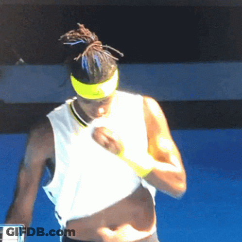 A Man Wearing A Yellow Headband And A White Tank Top With The Number 40 On The Screen GIF