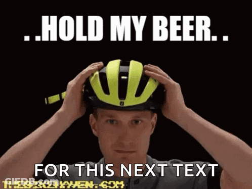 A Man Wearing A Yellow Helmet With The Words Hold My Beer For This Next Text GIF