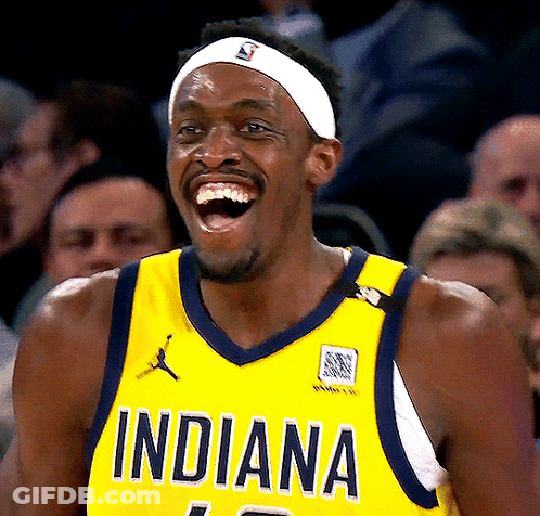A Man Wearing A Yellow Indiana Jersey Laughs With His Mouth Open GIF