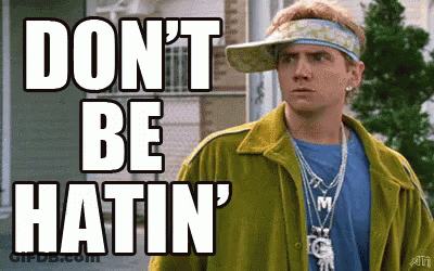 A Man Wearing A Yellow Jacket And A Visor Says " Don 'T Be Hatin " GIF