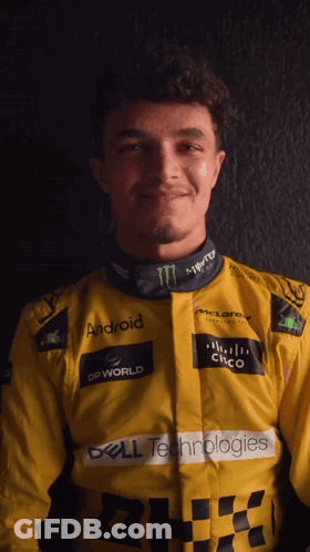 A Man Wearing A Yellow Jacket With Logos For Dell Technologies And Monster GIF