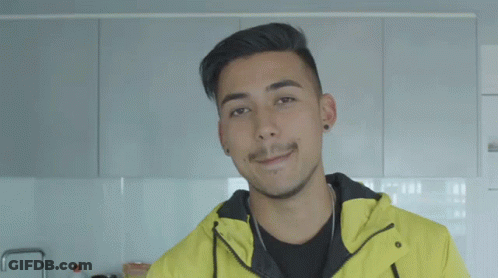 A Man Wearing A Yellow Jacket With Melbourne Written On The Bottom GIF