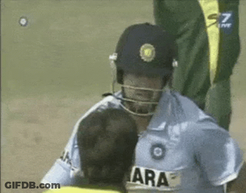 A Man Wearing A Yellow Jacket With The Name Afridi On It Talks To Another Man GIF
