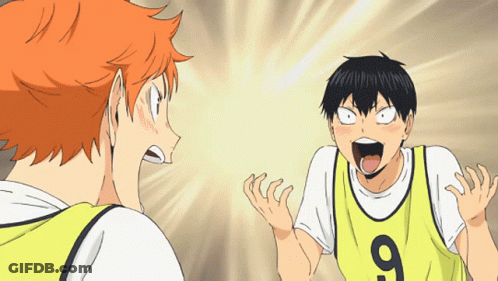 A Man Wearing A Yellow Jersey With The Number 9 On It Stands Next To Another Man GIF
