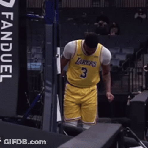 A Man Wearing A Yellow Lakers Jersey With The Number 3 GIF