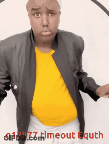 A Man Wearing A Yellow Shirt And A Black Jacket With The Words Q12877 Timeout Equth Written Below Him GIF