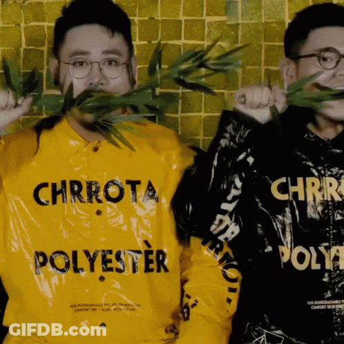 A Man Wearing A Yellow Shirt That Says Chrrota Polyester GIF