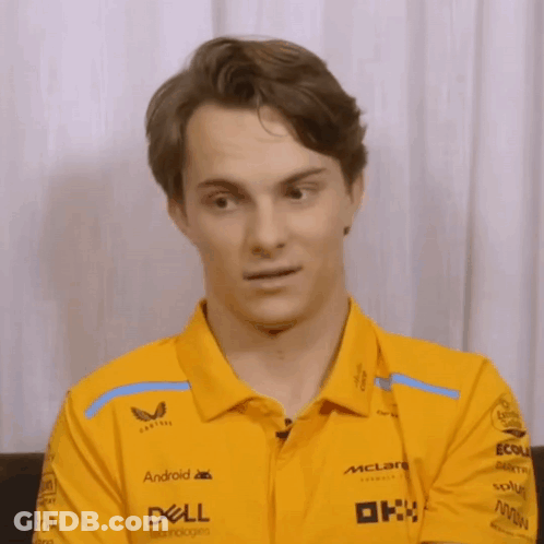 A Man Wearing A Yellow Shirt That Says Dell On The Sleeves GIF