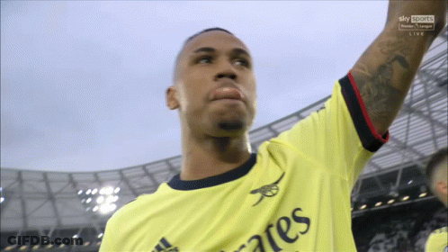 A Man Wearing A Yellow Shirt That Says " Emirates " On It GIF