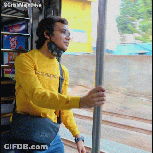 A Man Wearing A Yellow Shirt That Says International GIF