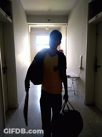 A Man Wearing A Yellow Shirt That Says ' Lg ' On It Is Carrying A Bag GIF