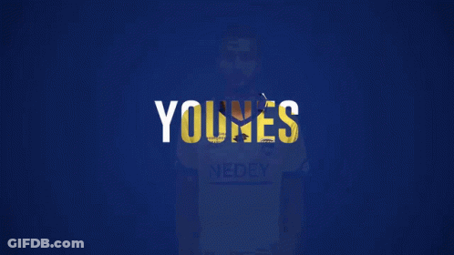 A Man Wearing A Yellow Shirt That Says Nedey On It GIF