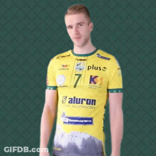A Man Wearing A Yellow Shirt With The Number 7 On The Front GIF