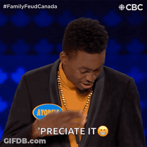 A Man Wearing A Yellow Turtleneck And A Black Suit Says Ayodele GIF