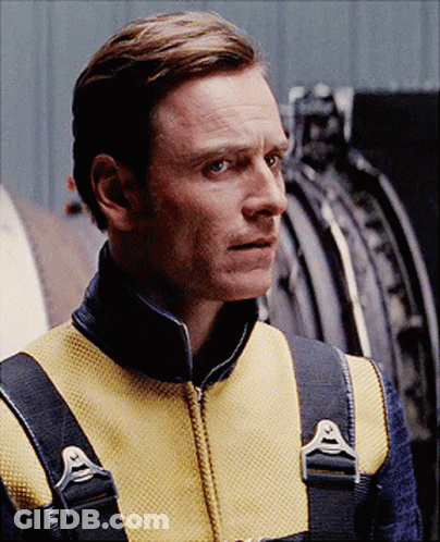 A Man Wearing A Yellow Vest With A Black Collar And Straps GIF