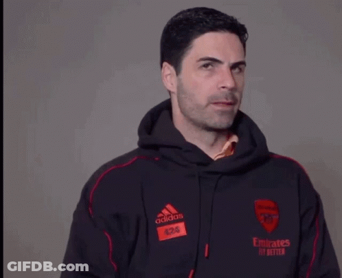 A Man Wearing An Adidas Hoodie With Emirates Fly Better Written On The Front GIF