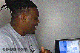A Man Wearing An Adidas Shirt Is Giving A Thumbs Up In Front Of A Television GIF